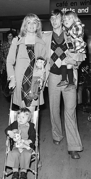 1973年克鲁伊夫和妻子丹妮，女儿香塔尔(Chantal)，长子苏西拉(Susila)